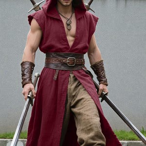 May include: A burgundy hooded tunic with a deep V-neck, brown trousers, and a leather belt. The outfit includes matching arm cuffs and is accessorized with a necklace and multiple swords. The overall aesthetic is reminiscent of fantasy attire.