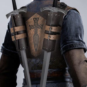 May include: A brown leather sword harness with two sheaths, each holding a silver sword. The harness features a Celtic cross design and adjustable straps with buckles. The swords are visible from the back.