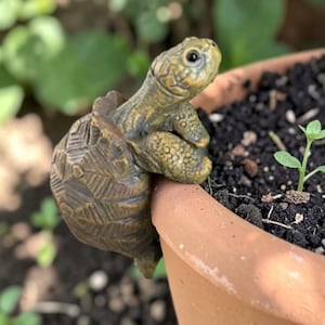 May include: A handmade wooden sign with the text "Welcome to our home" in a handwritten style. The sign is painted white with black lettering and a distressed finish. A small, decorative heart is in the lower right corner.