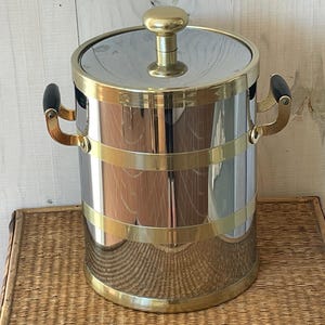 Wiaderko do lodu Vintage Kraftware: Srebrne i złote chłodziarki do szampana w stylu Mid-Century Modern