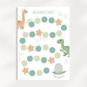 May include: A white reward chart featuring the text REWARD CHART at the top and YOU DID IT! at the bottom. The design includes a tan long-necked dinosaur, a green dinosaur, a speckled egg, and a path of alternating teal and light green circles.