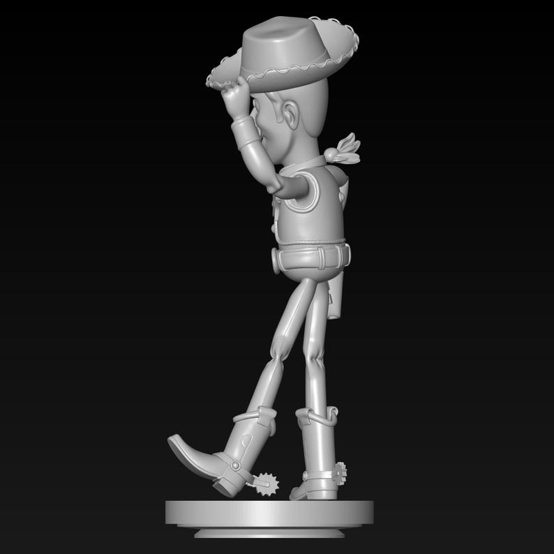 May include: A gray figurine of a cowboy character, wearing a hat, vest, and boots. The figure is posed with one arm raised, holding the hat. The figurine is standing on a round base.