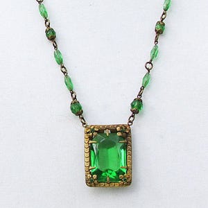 Antique green glass/brass pendant with faceted green glass beads