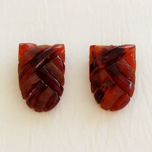Pair of bakelite dress clips, carved root beer bakelite