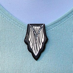 Vintage Art Deco black celluloid/aluminum/rhinestone dress clip