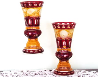 Pair of Bohemian ruby and amber glass vases with engraved flowers