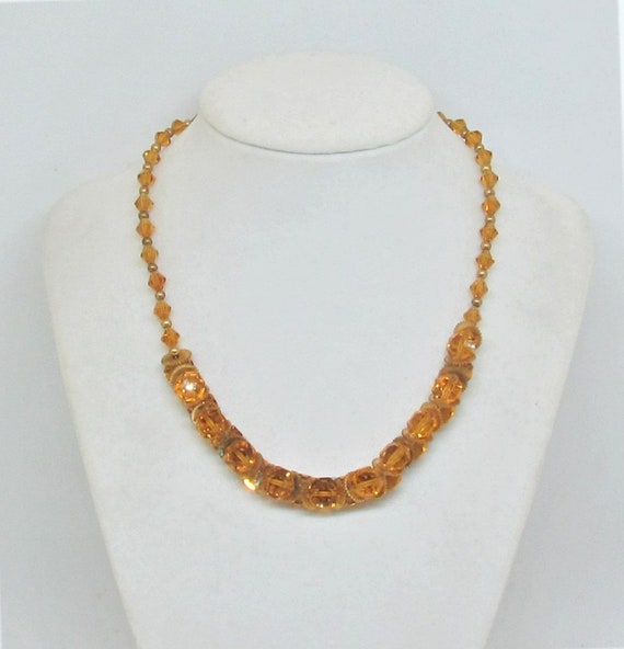 C.1930's amber glass and brass bead necklace