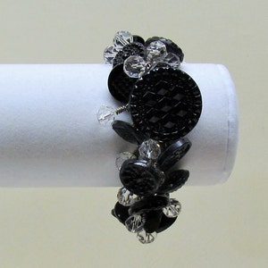 Handmade button bracelet made with Victorian black glass buttons and crystal bead dangles on silver chain