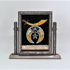 Vintage Shriners symbol reverse-painted in miniature swing frame