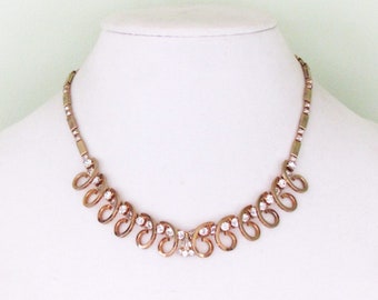 C.1950's rhinestone necklace in gold tone metal