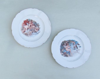 Pair of antique plates with cherubs