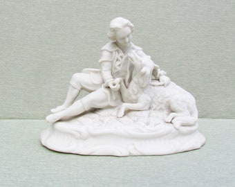 Antique parian figural group, young boy with dog in bisque porcelain