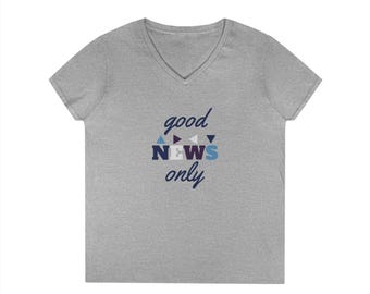 May include: A heather gray V-neck t-shirt with the words "good news only" in a stylized font. The text is in a mix of blue, white, and purple colors. The shirt is made of a soft material.