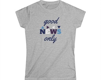 May include: A light gray t-shirt with the words "good NEWS only" in navy blue, white, and light blue. The word "NEWS" is in a stacked format with triangle accents above. The shirt is a crew neck style.