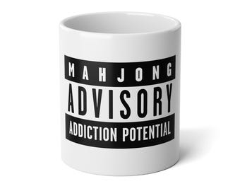 May include: A white ceramic mug with a black handle and the text "But First, Coffee" in a black, bold font. The mug is sitting on a wooden surface. The mug is approximately 4 inches tall.