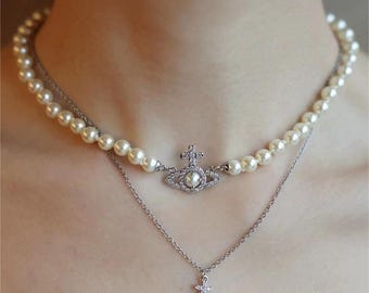 The Pearl Orbit Necklace — Iconic Elegance in Ivory Radiance