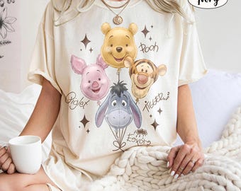 Camiseta retro de Winnie Pooh y sus amigos con globos y colores cómodos, camiseta vintage de Tigger, Eeyore y Piglet, regalo para el viaje familiar a Disneyland 2026