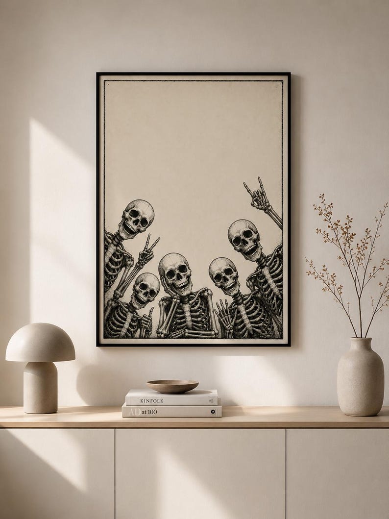 May include: A framed wall art print featuring a black and white illustration of five skeletons posing together. The skeletons are arranged at the bottom of the frame, making various hand gestures including peace signs and a rock and roll hand sign.