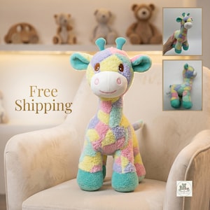 May include: A plush giraffe toy featuring a multi-colored patchwork pattern in pastel shades of yellow, pink, blue, and purple. The stuffed animal has a white muzzle, brown embroidered eyes, two small teal horns, and teal-colored hooves.