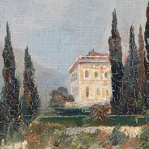 Close up of canvas print showing the villa surrounded by trees.
