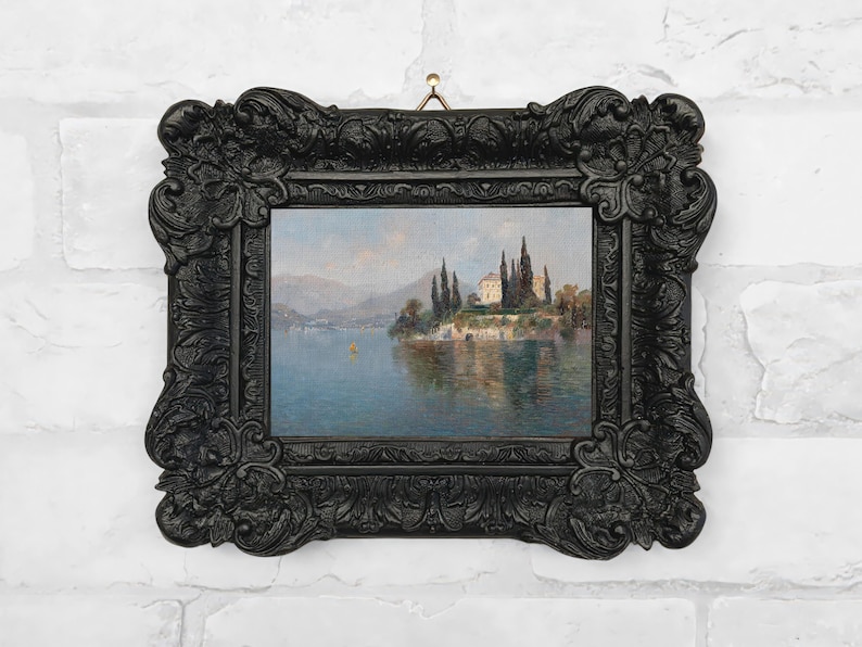 Framed vintage-style canvas print of a serene landscape painting by Emilie Mediz-Pelikan, showing Villa Cipressi overlooking Lake Como, with tall cypress trees, terraced stone walls, and still blue water, all set in an ornate black antique-style frame.
