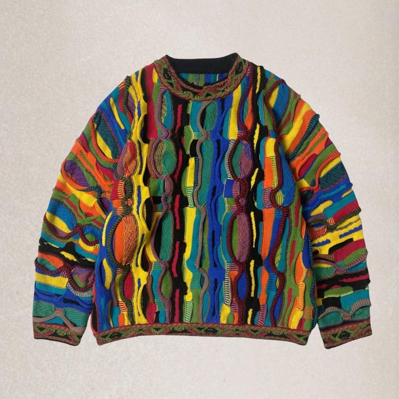 May include: A multi-coloured patterned sweater with a crew neck. The sweater displays a vibrant mix of colours including blue, yellow, green, orange, and red. The design incorporates textured, raised elements throughout the garment, creating a unique visual appeal. The cuffs and neckline have a detailed trim.