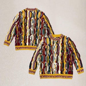 May include: Two colourful sweaters with a unique pattern. The sweaters feature a mix of yellow, burgundy, green, white, and purple vertical designs. The collars, cuffs, and hems are yellow with a detailed pattern.
