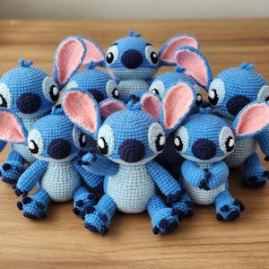 May include: A set of three ceramic mugs with a speckled, matte finish in cream, light grey, and dark grey. Each mug has a simple, modern design and a rounded handle.