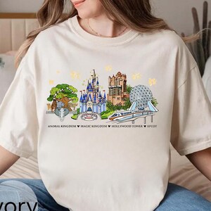 Op de afbeelding: Een set van drie keramische mokken met een gespikkelde, matte afwerking. De mokken zijn in crème, lichtgrijs en donkergrijs. Elke mok heeft een eenvoudig, minimalistisch ontwerp.