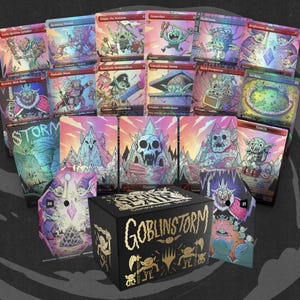 May include: A collection of Magic: The Gathering cards and a black Goblinstorm Commander Deck box. The cards feature colorful illustrations of goblins and fantasy landscapes. The box has gold text and goblin illustrations.