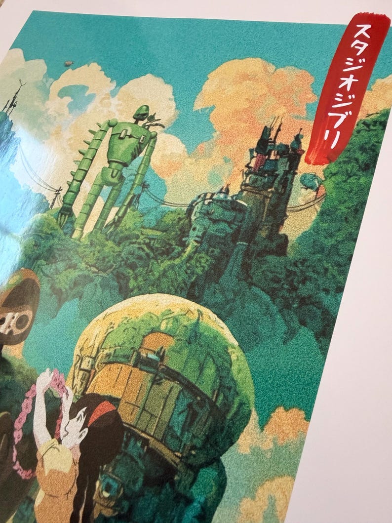 May include: A vibrant illustration depicting a green robot, a fortress, and a young woman with a floral garland. The artwork has a fantasy theme, with a blue sky and clouds in the background. Japanese text is visible.