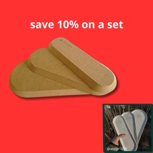 May include: Three light brown, oval-shaped wooden trays stacked on top of each other against a bright red background with the text save 10% on a set. A small inset image shows three light-coloured trays held in a hand with the text atelje1030.