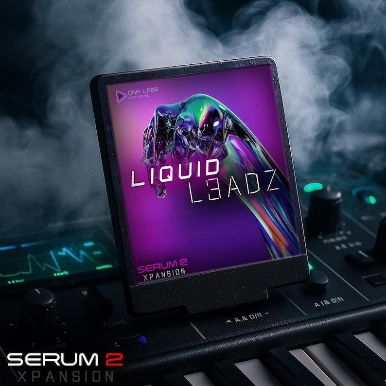 May include: A black electronic device displaying the text "LIQUID L3ADZ" on a purple background. The device is on a synthesizer keyboard. The text "SERUM 2 XPANSION" is also visible. The image has a dark, smoky atmosphere.