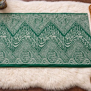 May include: A set of three ceramic mugs with a speckled, matte finish. The mugs are in shades of cream, light gray, and dark gray. Each mug has a simple, minimalist design, perfect for coffee or tea.