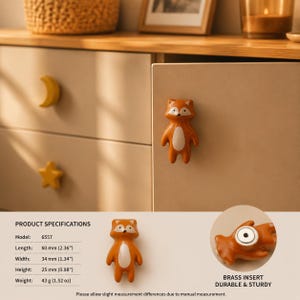 May include: A fox-shaped cabinet knob in orange and white ceramic with a brass insert. The product specifications list a length of 2.36 inches, a width of 1.34 inches, a height of 0.98 inches, and a weight of 1.52 ounces for model 6557.