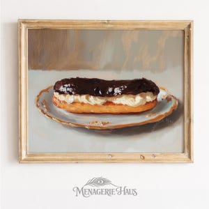 May include: An oil painting in a gold frame depicting a single chocolate eclair on a white scalloped plate with gold trim. The eclair features a dark chocolate glaze over a thick layer of cream filling and a golden-brown pastry base.