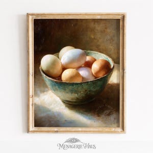 May include: A framed still life painting featuring a teal bowl filled with eggs of varying colors. The eggs range from white to brown, with a few pale yellow ones. The bowl sits on a white surface, and the background is a dark brown.
