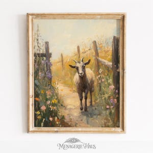 May include: An oil painting in a light wood frame depicting a goat standing on a dirt path between two wooden fence posts. The scene is surrounded by tall yellow grasses and colorful wildflowers in shades of purple, orange, and white.