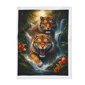 May include: A white blanket featuring a vibrant illustration of two tigers in a jungle setting. The tigers, with orange and black stripes, are positioned near a waterfall, surrounded by lush greenery and orange flowers.