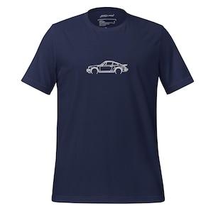 May include: A navy blue t-shirt with a white outline of a vintage sports car. The shirt has a crew neck and short sleeves. The brand name "SPECLINES" is printed on the upper back of the shirt.