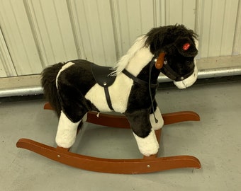 Vintage Stuffed Faux Fur Rocking Horse with Bushy Tail and Mane. Wearing Saddle and Bridle, Side Wood Handles to Hold. Wooden Rockers.