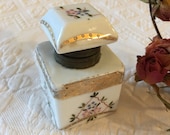 Vintage Porcelain Inkwell With Hand Painted Flowers and Textured Gold Details With Vines and Curved Shapes. Metal Edged Opening and Hinge.