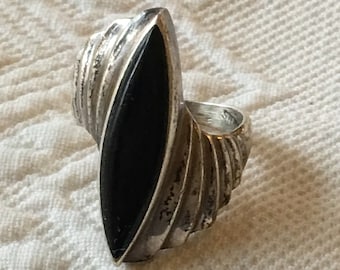 Vintage Sterling Silver and Black Onyx Ring. Marked Sterling. Pointed Oval Black Onyx Stone In Ridged and Swirling Sterling Silver Ring.