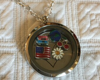 Teacher Themed Locket. Large Silver Magnetic Locket, Follow Your Heart Back Plate. Books Flag Globe Cherries and Daisy Charms. Heart Chain.