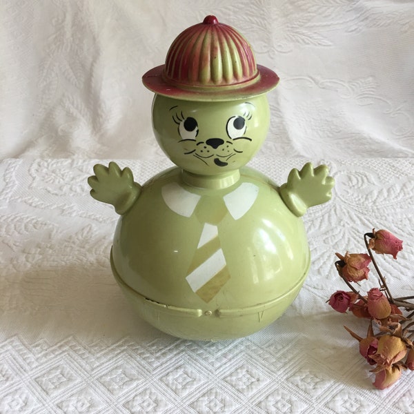 Vintage Baby Roly Poly Rattle Toy. 1960s Weighted Rattling Baby Toy. Bat Him and He Always Stands Upright. Green Man with Fireman Type Hat.