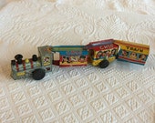 Vintage 1960s Linemar Wind Up Toy Tin Train. Engine and Three Cars With Animals, Clowns and Musical Men.
