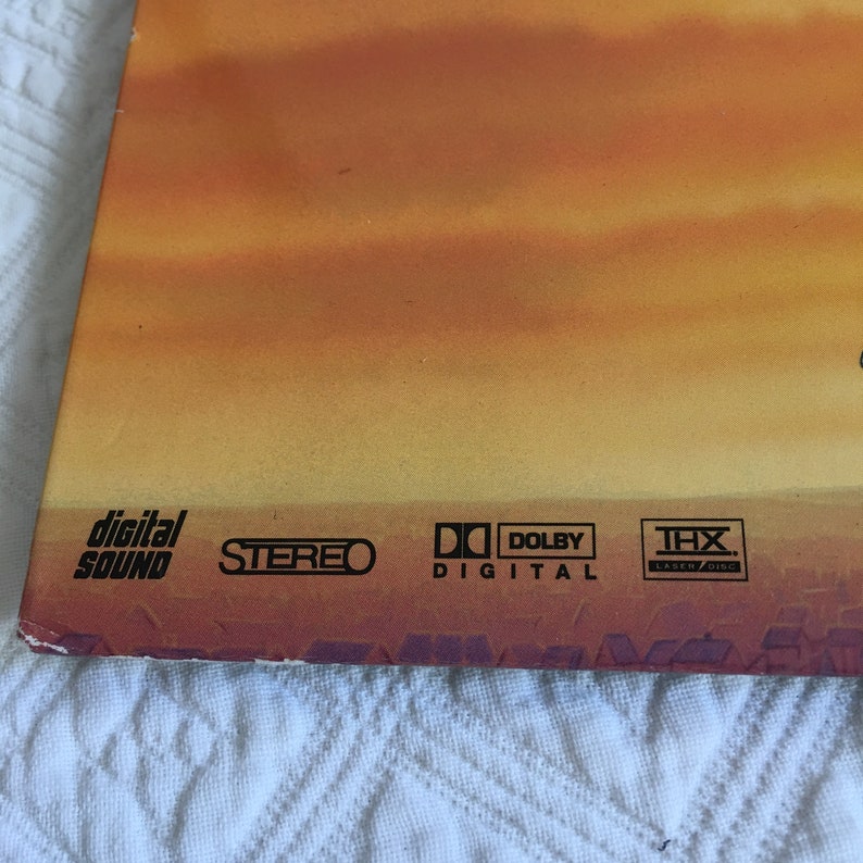May include: Close-up of a DVD case with the logos for Digital Sound, Stereo, Dolby Digital, and THX.