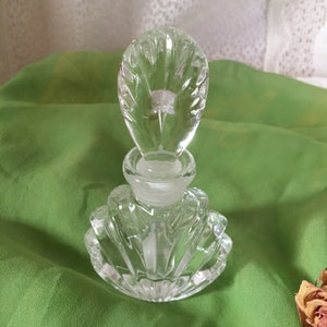 Vintage Clear Crystal Perfume Bottle with Oval Stopper and Seashell Shaped Bottle. Seashell Shaped Bottle In Thick Glass.