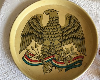 Vintage Patriotic Tray. Round Tray With Eagle Holding Arrows and Olive Branch, Streamer of Red White and Blue. Yellow Top, Red Bottom.