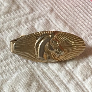Vintage Tie Clip. Two Gold Metal Tie Bars. One Oval With Sunburst and Horse Design, One Rectangle With Textured Lines.